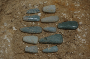 A jade axe offering found along the central axis of the solar temple complex of Ceibal (Photo courtesy of Takeshi Inomata) A jade axe offering found along the central axis of the solar temple complex of Ceibal (Photo courtesy of Takeshi Inomata)